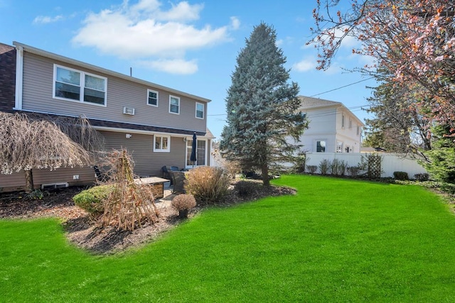 70 Spruce St, Hicksville, NY 11801 - rear view of house with fence and a lawn