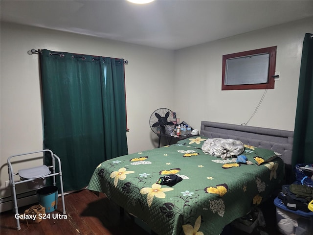 17709 112th Ave, Addisleigh Park, NY 11433 - bedroom featuring baseboard heating and wood finished floors