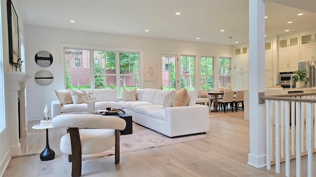 8 Marker Rdg Unit 4, Irvington, NY 10533 - living area featuring light wood-style flooring, recessed lighting, and a fireplace