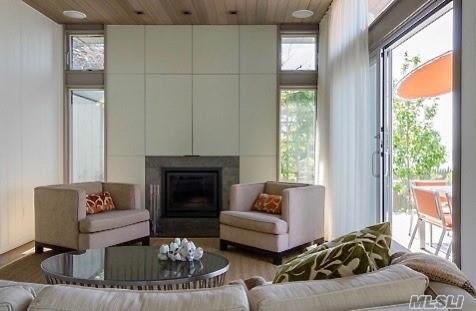 248 Bay Walk, Fire Island Pines, NY 11782 - living room with wooden ceiling and a fireplace