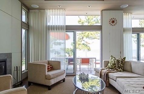 248 Bay Walk, Fire Island Pines, NY 11782 - living room with a fireplace