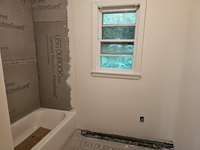 23 Beverly Rd, Glen Cove, NY 11542 - full bath with healthy amount of natural light and a bathtub
