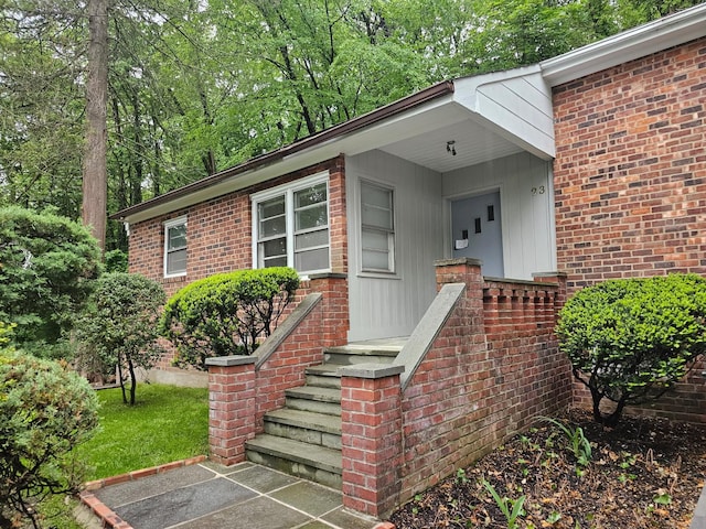 23 Beverly Rd, Glen Cove, NY 11542 - property entrance featuring brick siding