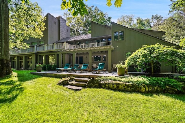 17 Eastwoods Rd, Pound Ridge, NY 10576 - back of property featuring a patio area and a lawn