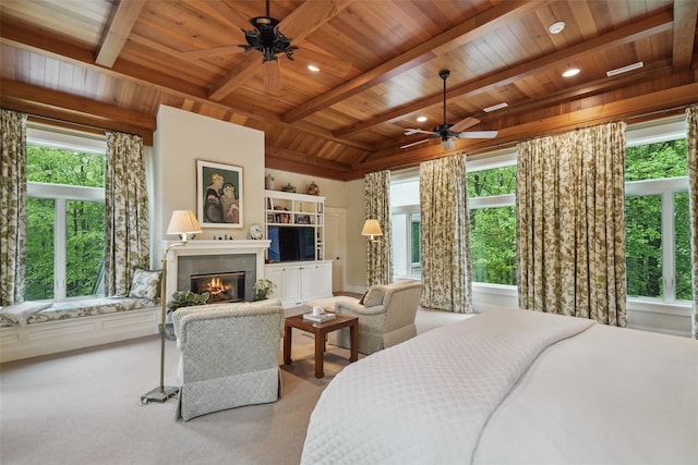 17 Eastwoods Rd, Pound Ridge, NY 10576 - carpeted bedroom with wood ceiling with exposed beams, a glass covered fireplace, and recessed lighting