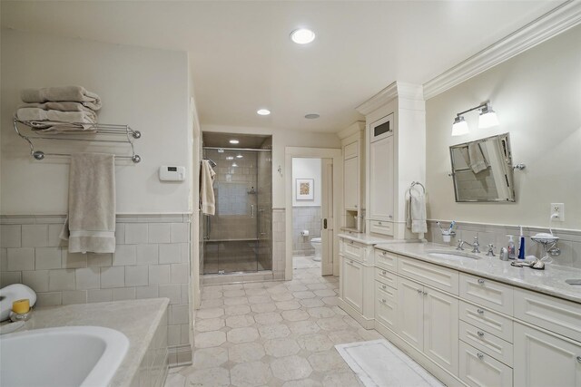 17 Eastwoods Rd, Pound Ridge, NY 10576 - full bathroom featuring tile walls, a stall shower, double vanity, a garden tub, and tile patterned floors
