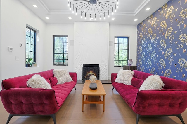 165 Valley Rd, New Rochelle, NY 10804 - living area with a large fireplace, ornamental molding, a raised ceiling, and recessed lighting
