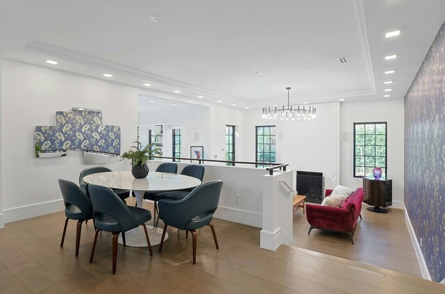 165 Valley Rd, New Rochelle, NY 10804 - dining room featuring a tray ceiling, wood finished floors, and baseboards