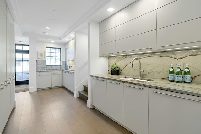 165 Valley Rd, New Rochelle, NY 10804 - kitchen featuring recessed lighting, white cabinetry, a sink, and decorative backsplash