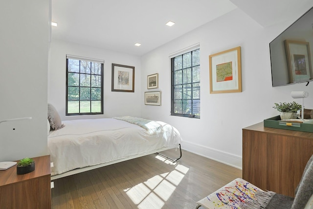 165 Valley Rd, New Rochelle, NY 10804 - bedroom featuring baseboards, multiple windows, and wood finished floors