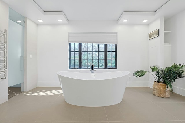 165 Valley Rd, New Rochelle, NY 10804 - full bathroom with tile patterned floors, baseboards, and a freestanding tub