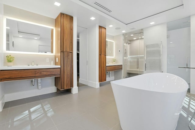 165 Valley Rd, New Rochelle, NY 10804 - full bathroom featuring visible vents, baseboards, a soaking tub, vanity, and tile patterned floors
