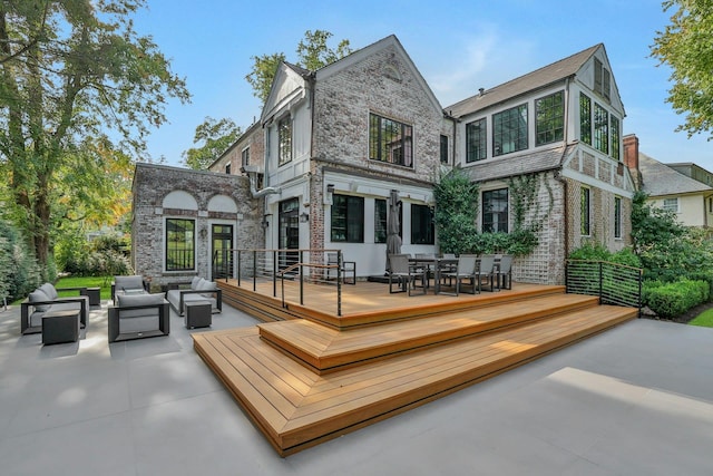 165 Valley Rd, New Rochelle, NY 10804 - rear view of property featuring a wooden deck, stone siding, and an outdoor hangout area