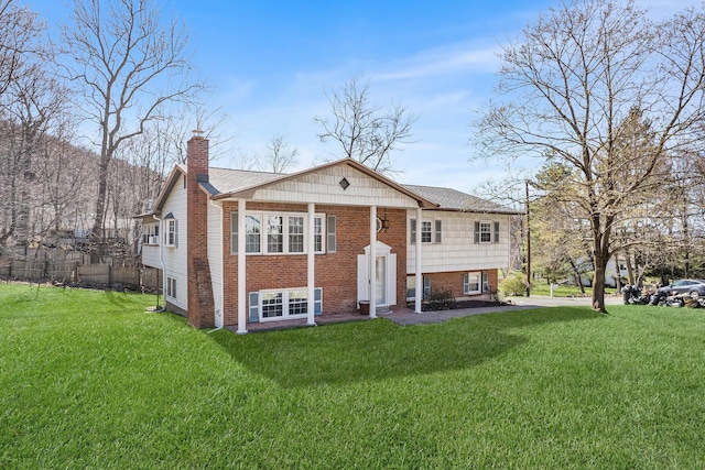 927 Mica Ct, Valley Cottage, NY 10989 - split foyer home with brick siding, a chimney, and a front lawn