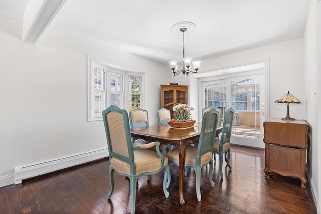 927 Mica Ct, Valley Cottage, NY 10989 - dining room with a baseboard heating unit, a notable chandelier, dark wood finished floors, and a wealth of natural light