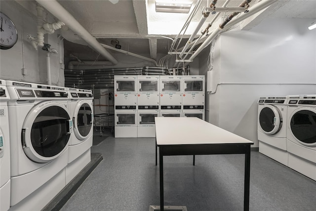 shared laundry area with stacked washer and dryer and washer and clothes dryer