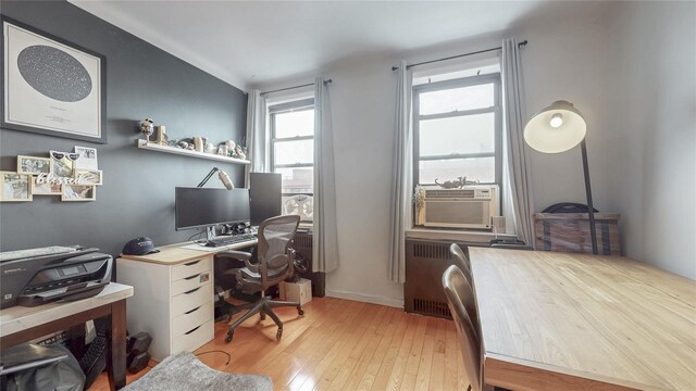 69-40 Yellowstone Blvd Unit 620, Forest Hills, NY 11375 - office area featuring light wood finished floors, cooling unit, and radiator heating unit