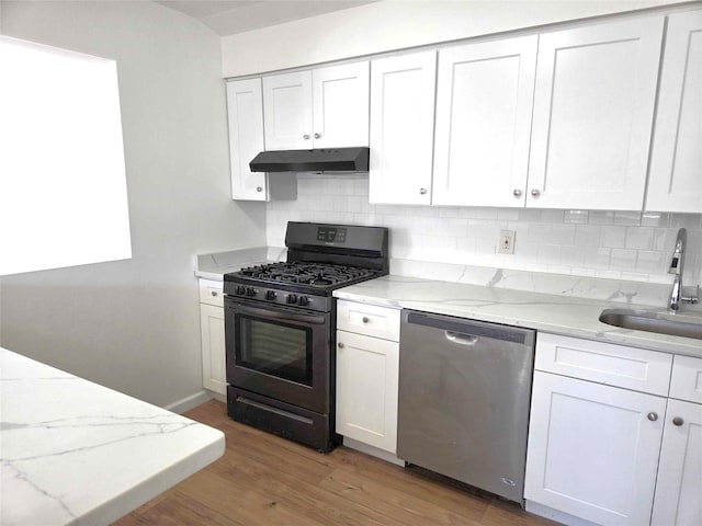 134-15 160th St, Jamaica, NY 11434 - kitchen featuring dishwasher, black range with gas cooktop, under cabinet range hood, a sink, and decorative backsplash