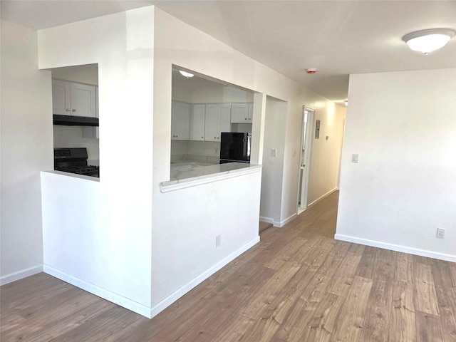 134-15 160th St, Jamaica, NY 11434 - empty room featuring wood finished floors and baseboards
