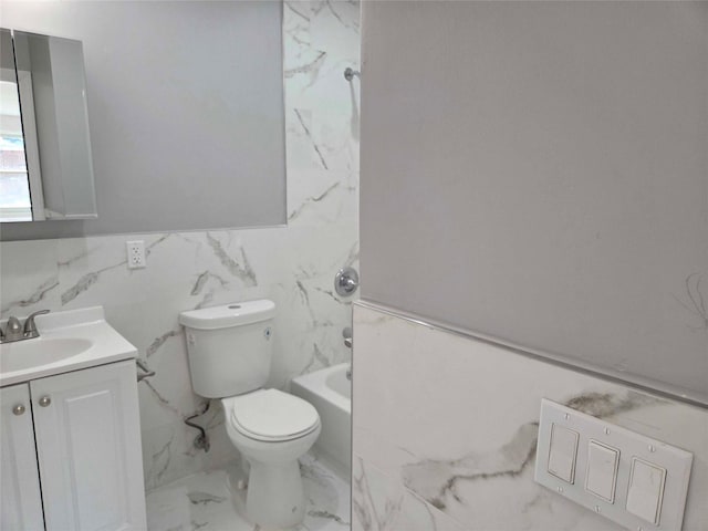 134-15 160th St, Jamaica, NY 11434 - full bath featuring marble finish flooring, vanity, toilet, tile walls, and wainscoting