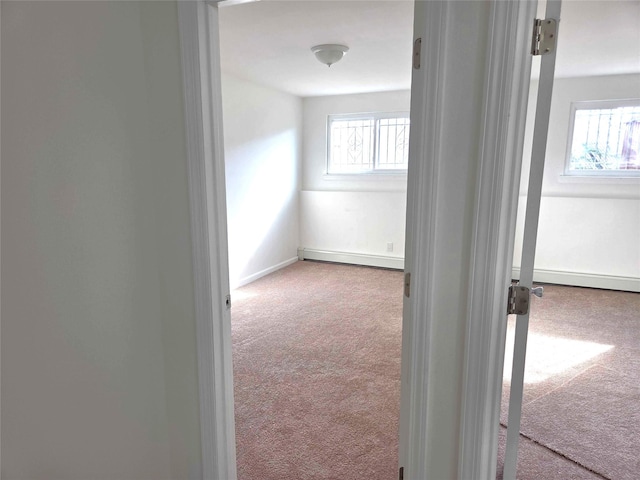 134-15 160th St, Jamaica, NY 11434 - hallway with carpet, a baseboard radiator, plenty of natural light, and baseboards