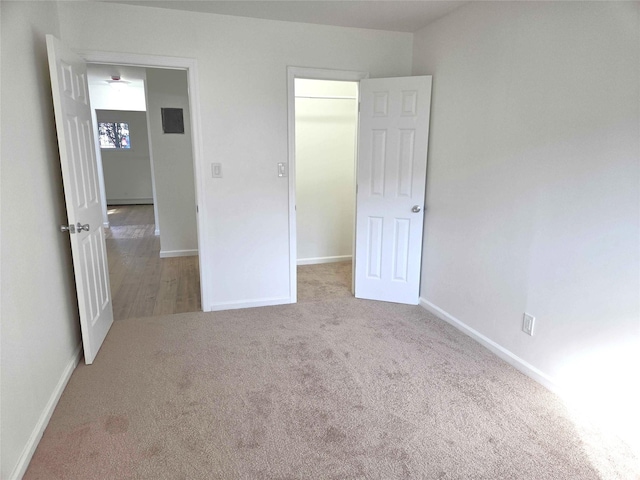 134-15 160th St, Jamaica, NY 11434 - unfurnished bedroom with a spacious closet, carpet floors, baseboards, and a closet
