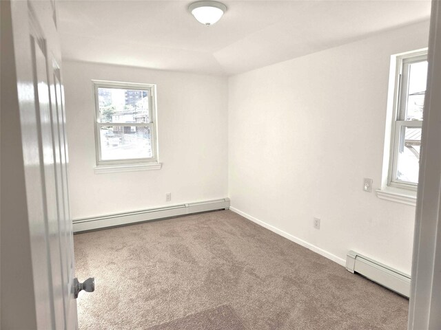 134-15 160th St, Jamaica, NY 11434 - spare room featuring baseboard heating, carpet flooring, and baseboards