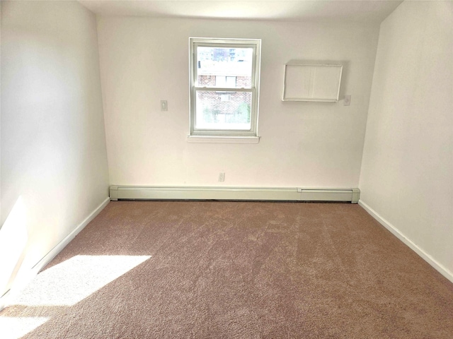 134-15 160th St, Jamaica, NY 11434 - carpeted spare room with a baseboard radiator and baseboards