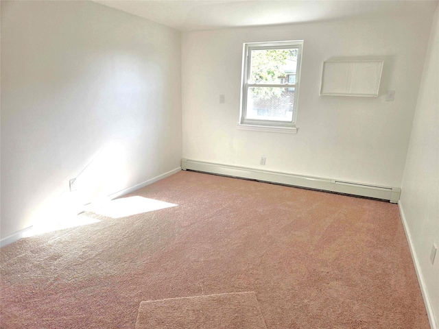 134-15 160th St, Jamaica, NY 11434 - carpeted empty room with a baseboard radiator and baseboards