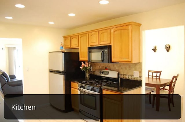 kitchen with tasteful backsplash, appliances with stainless steel finishes, light brown cabinetry, and recessed lighting