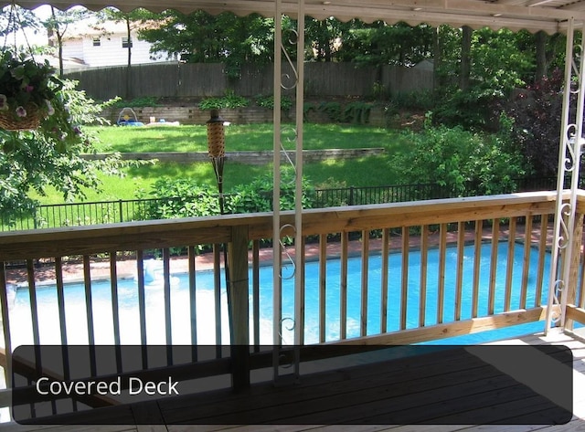 view of pool featuring a fenced backyard, a fenced in pool, and a lawn
