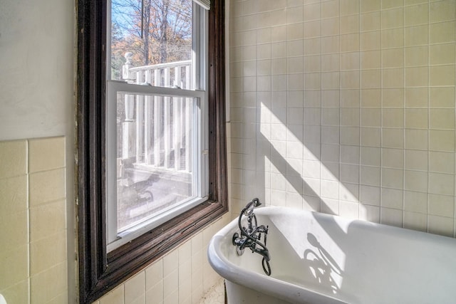 58 Summitville Rd, Wurtsboro, NY 12790 - full bathroom with a freestanding bath, tile walls, and a healthy amount of sunlight