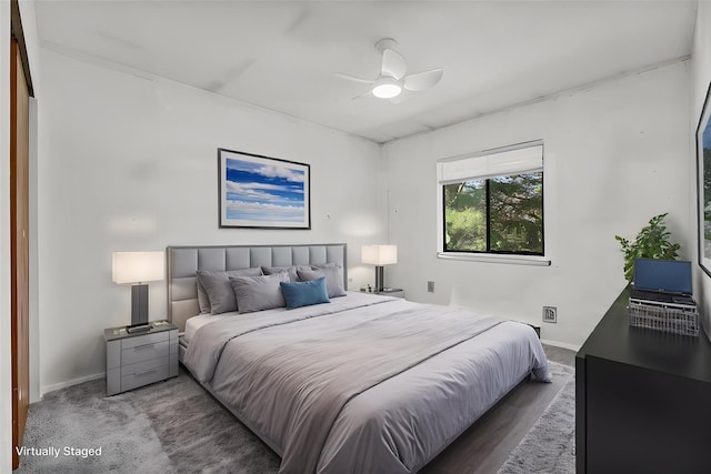 bedroom with a ceiling fan and baseboards