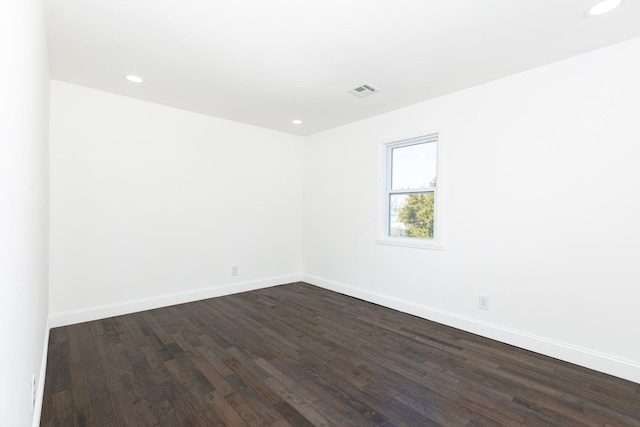 38 Melody Ln, Amityville, NY 11701 - spare room featuring dark wood-type flooring, baseboards, visible vents, and recessed lighting