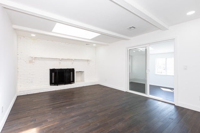 38 Melody Ln, Amityville, NY 11701 - unfurnished living room with beamed ceiling, baseboards, a fireplace, and dark wood-style floors