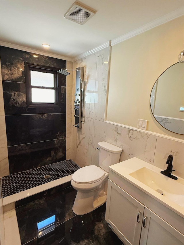 bathroom featuring a tile shower, tile walls, visible vents, and ornamental molding