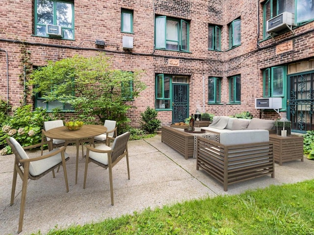 view of patio / terrace featuring outdoor dining space and an outdoor living space
