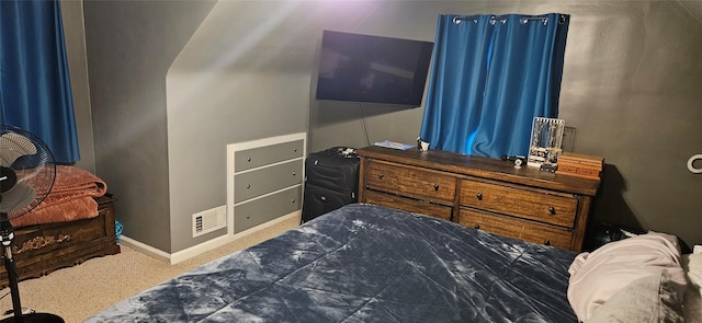 carpeted bedroom with visible vents and baseboards
