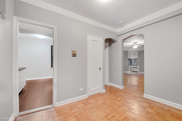 41-09 41st St, Sunnyside, NY 11104 - unfurnished room with arched walkways, baseboards, a ceiling fan, and crown molding