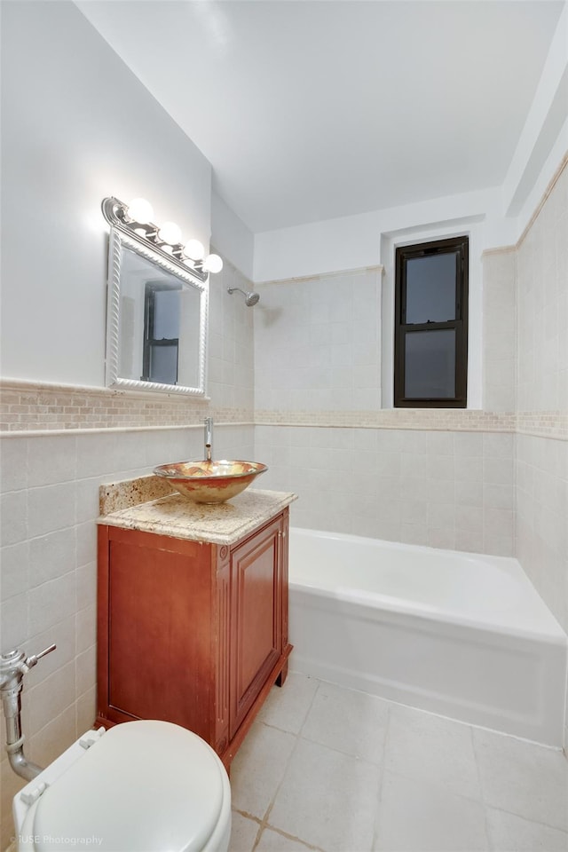 41-09 41st St, Sunnyside, NY 11104 - bathroom with toilet, tile walls, vanity, wainscoting, and tile patterned floors
