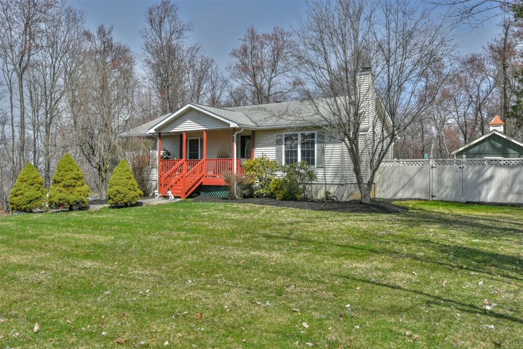 1446 State Route 17a, Warwick, NY 10990 - view of front of property featuring a porch, a chimney, and a front lawn