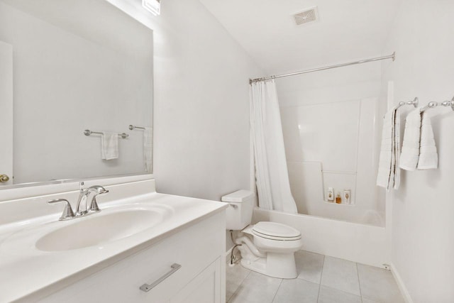 full bathroom featuring toilet, tile patterned flooring, vanity, and shower / tub combo with curtain
