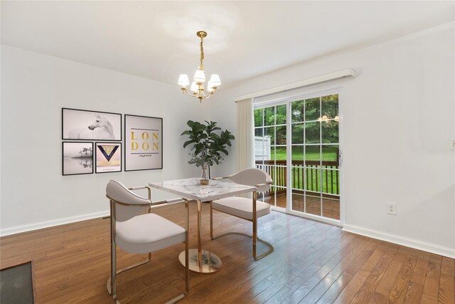 123 Park Rd Extension, Goldens Bridge, NY 10526 - dining space featuring a chandelier, wood-type flooring, and baseboards