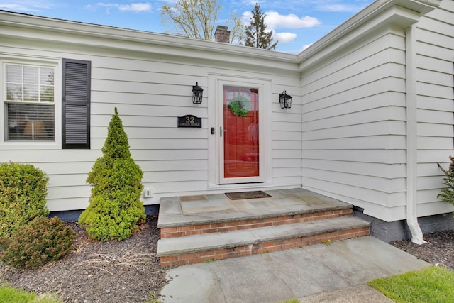 entrance to property with a chimney