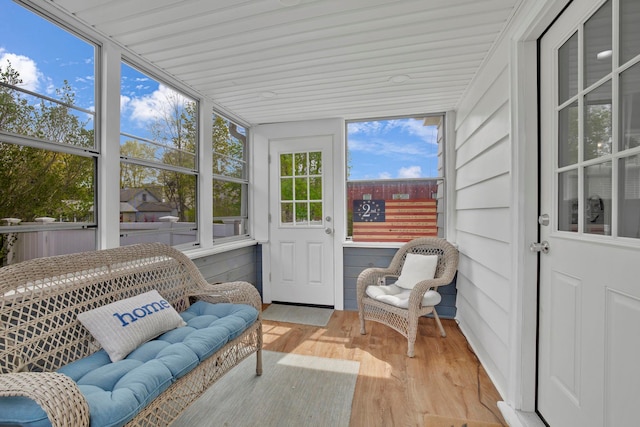 sunroom with an outdoor living space