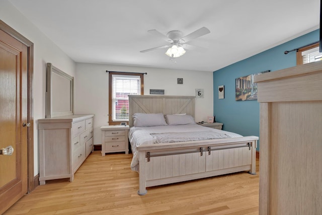 bedroom with ceiling fan and light wood-type flooring