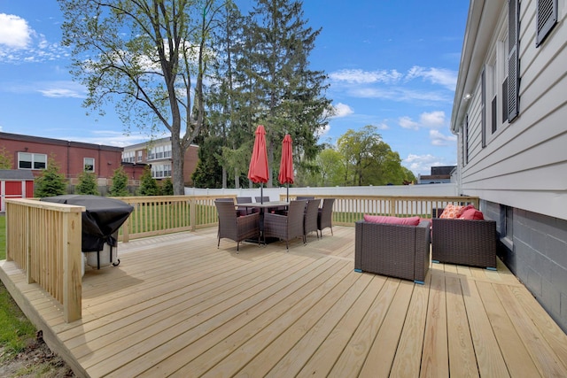 deck with outdoor dining area and an outdoor living space