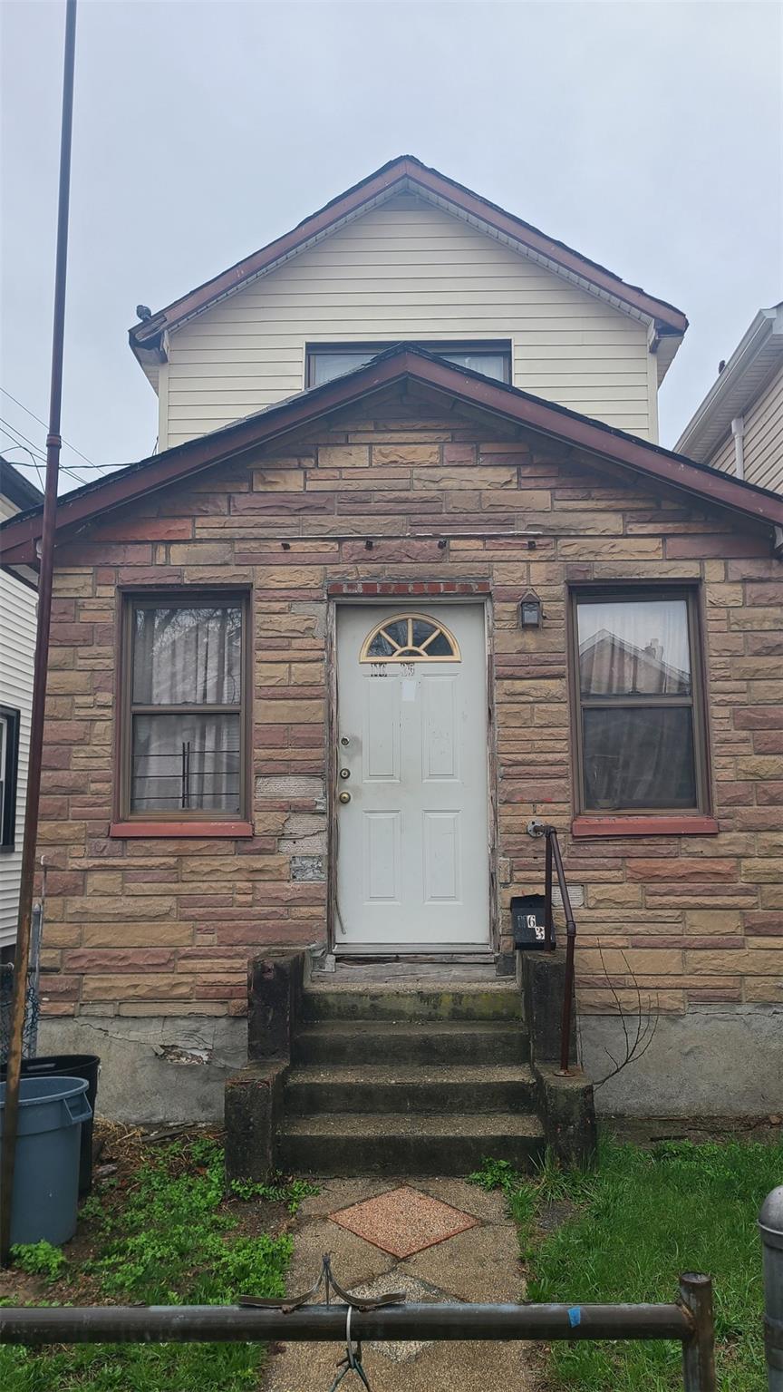 11635 127th St, South Ozone Park, NY 11420 - entrance to property featuring stone siding and fence
