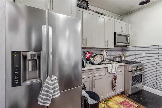kitchen featuring stainless steel appliances and light countertops