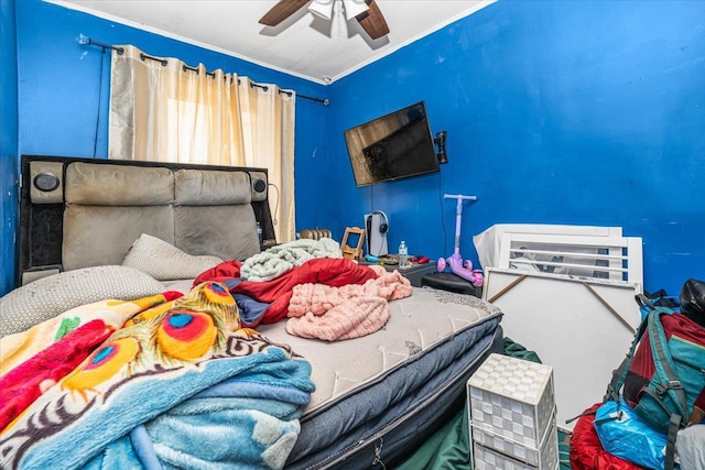 bedroom featuring crown molding and a ceiling fan